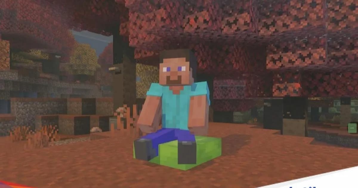 Karakter Steve dari Minecraft sedang duduk di atas Bantal berwarna biru di dalam dunia game